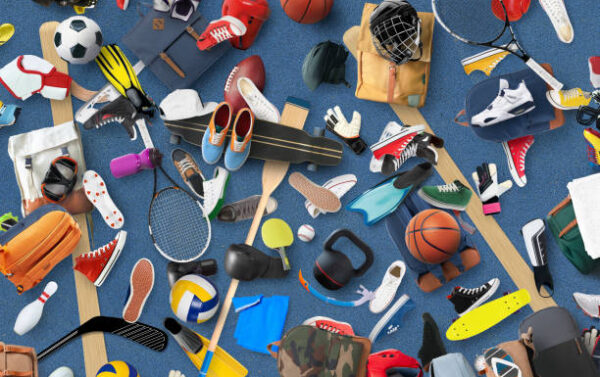 Sports equipment and clothing are scattered in the gym